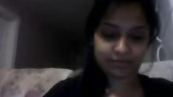 Sweet Noida girl Angel sitting naked on webcam pressing her boob and fingering her hairy pussy.