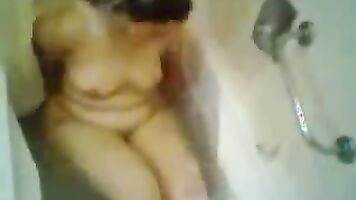 Sanam bhabhi from Lahore in bath tube taking shower while her hubby is filming her action!.